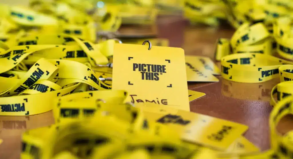 Picture This branded lanyards and name badges laid out on a table
